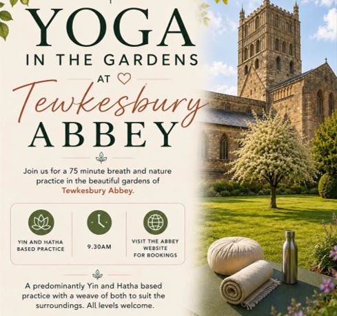 People taking part in yoga under the Moon in Tewkesbury Abbey.